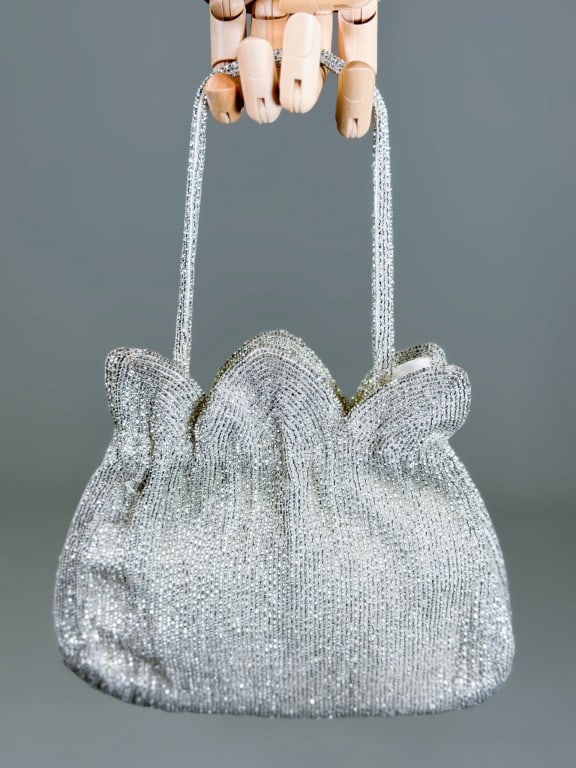 Vintage 1960s Beaded Petal Evening Bag: Vintage 1960s Beaded Petal Evening Bag having metal frame lock closure with petal details. Measuring approximately 7 inches high by 8 inches wide by 2 inches deep. From the lifetime collection, fashio