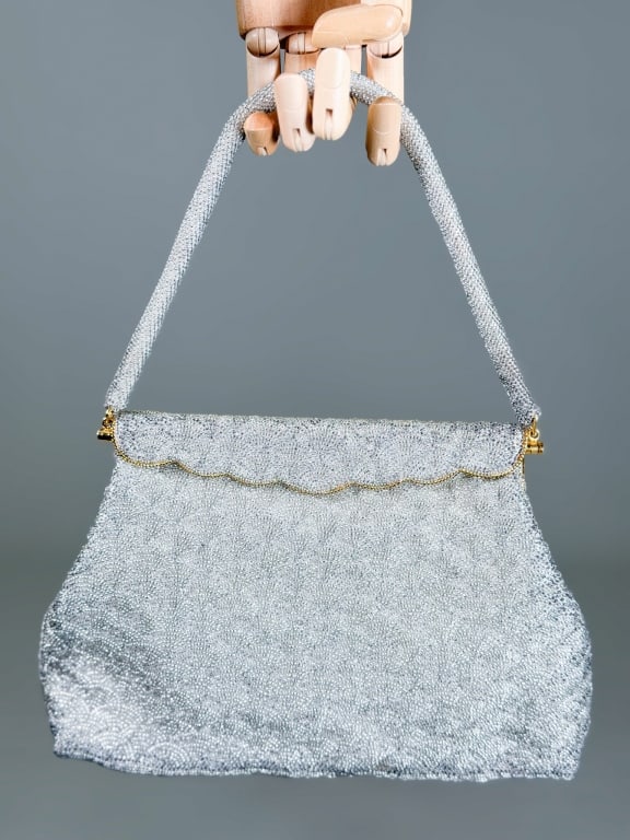Vintage 1960s Beaded Evening Bag: Vintage 1960s Beaded Evening Bag having metal frame lock closure with interior pockets. Measuring approximately 7 inches high by 10 inches wide by 1.5 inches deep. From the lifetime collection, fashio