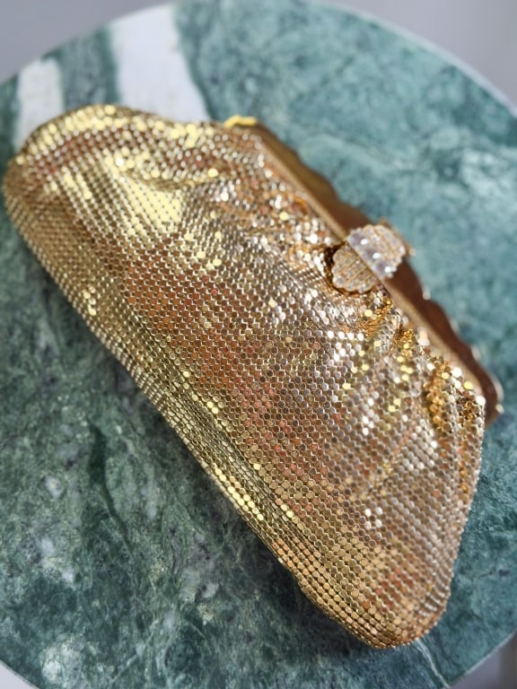 Vintage 1950s Whiting & Davis Metal Mesh Clutch: Vintage 1950s Whiting & Davis Metal Mesh Clutch having lock closure at front with rhinestone detail. Measuring approximately 4.5 inches high by 9 inches wide by 2 inches deep. From the lifetime collec