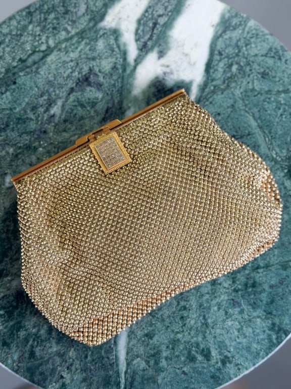 Vintage 1950s Whiting & Davis Metal Mesh Clutch: Vintage 1950s Whiting & Davis Metal Mesh Clutch having lock closure at front with rhinestone detail. Measuring approximately 5 inches high by 7 inches wide by 1 inch thick. From the lifetime collectio