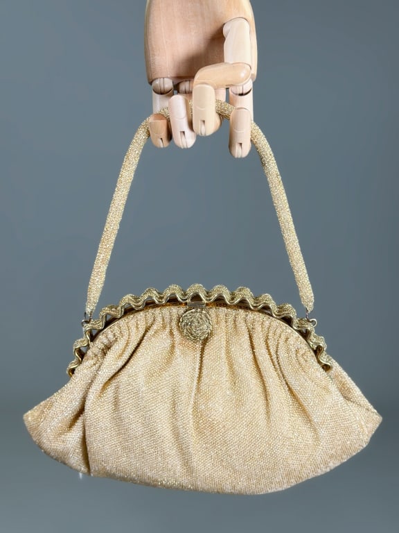 Vintage 1960s Beaded Evening Bag: Vintage 1960s Beaded Evening Bag having metal frame lock closure. Measuring approximately 6 inches high by 11 inches wide by 3 inches deep. From the lifetime collection, fashion archive and business i