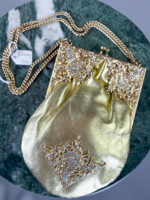 Vintage 1960s Gold Leather Rhinestone Evening Bag: Vintage 1960s Gold Leather Rhinestone Evening Bag having metal frame kiss lock closure and chain strap. Measuring approximately 8 inches high by 6 inches wide by 1 inch deep. From the lifetime collect