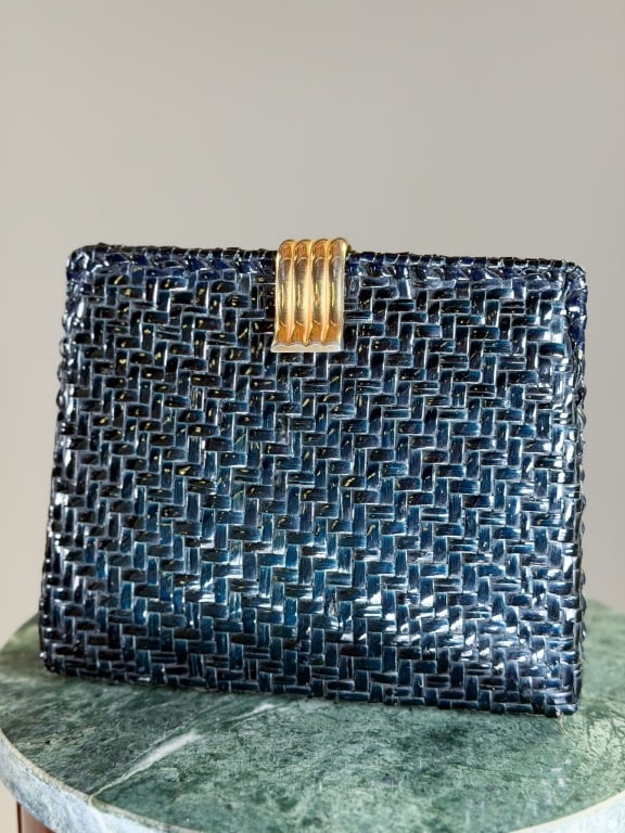 Vintage 1960s Woven Straw Clutch Bag: Vintage 1960s Woven Straw Clutch Bag having metal frame lock closure with chain strap. Measuring approximately 6.5 inches high by 8 inches wide by 2 inches deep. From the lifetime collection, fashion 
