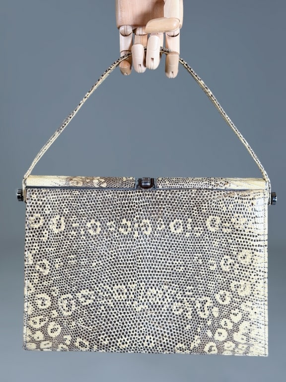 Vintage 1960s Snakeskin Purse Bag: Vintage 1960s Snakeskin Purse Bag having metal frame lock closure and shoulder strap. Measuring approximately 8.5 inches tall by 11.5 inches wide by 3.5 inches deep. From the lifetime collection, fash