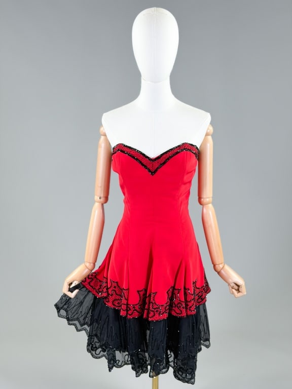 Vintage 1980s Fabrice Beaded Party Dress: Vintage 1980s Fabrice Beaded Party Dress having back zip closure and beading throughout. Marked size 12. Measuring 36 inch bust, 30 inch waist, 33 inches long. From the lifetime collection, fashion ar