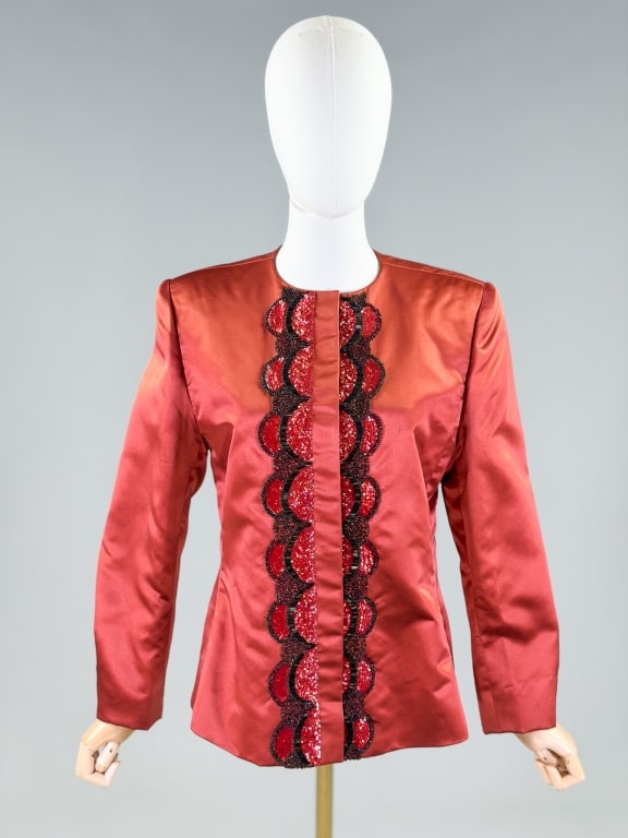 Vintage 1980s Andre Laug Embellished Satin Blazer: Vintage 1980s Andre Laug Embellished Satin Blazer having button front closure with embellishments. Marked size 12. Measuring 40 inch bust, 36 inch waist, 25 inches long, 23 inch sleeve length. From th
