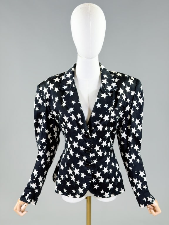 Vintage 1980s Star Print Blazer Jacket: Vintage 1980s Star Print Blazer Jacket having button front closure. Measuring 40 inch bust, 36 inch waist, 25 inches long, 24 inch sleeve length. General wear as shown throughout. From the lifetime co