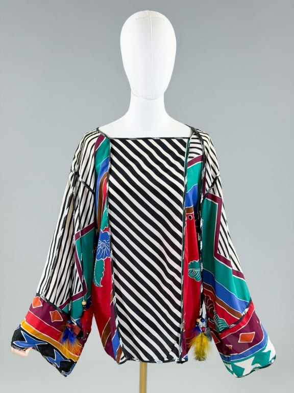 Vintage 1980s Silk Stripe Floral Feather Shirt Top: Vintage 1980s Silk Stripe Floral Feather Shirt Top having print throughout with feather details. Measuring 46 inch bust, 27 inches long, 21 inch sleeve length. From the lifetime collection, fashion ar