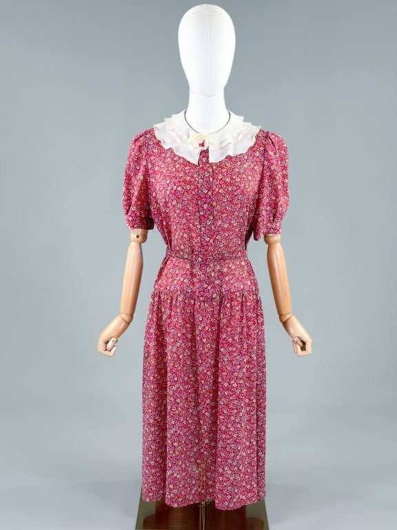 Vintage 1980s Floral Print Drop Waist Dress: Vintage 1980s Floral Print Drop Waist Dress having button front closure. Marked size 12. Measuring 40 inch bust, 38 inch drop waist, 44 inches long, 12 inch sleeve length. From the lifetime collection