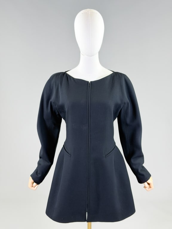 Vintage 1980s Claude Montana Wool Zip Front Dress: Vintage 1980s Claude Montana Wool Zip Front Dress having zip front closure and two front pockets. Marked size 42. Measuring 36 inch bust, 30 inch waist, 33 inches long, 25 inch sleeve length. From the