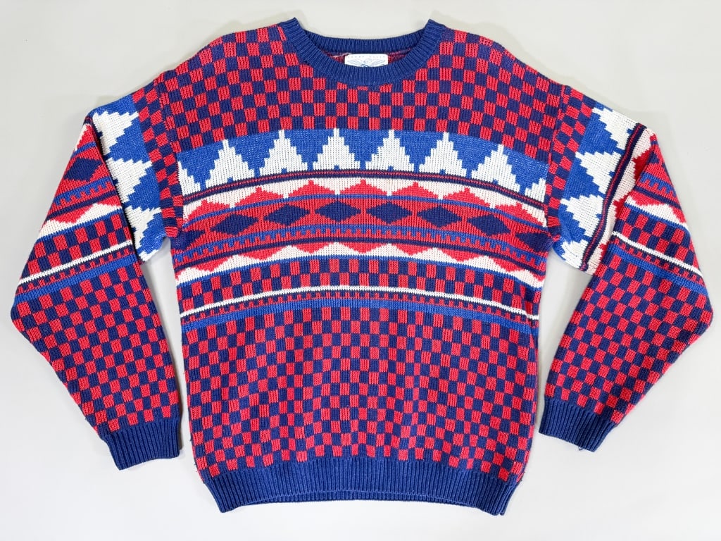 Vintage 1980s Perry Ellis Sweater Knit Top: Vintage 1980s Perry Ellis Sweater Knit Top having stretch throughout. Marked size Medium. Measuring 48-62 inch chest, 28 inches long, 27 inch sleeve length. General wear as shown throughout. From the 