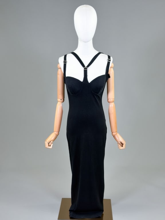 Vintage 1990s Cotton Knit Bondage Strap Dress: Vintage 1990s Cotton Knit Bondage Strap Dress having stretch throughout with bra cups and buckle details. Labeled Romans 2000. Measuring 32-38 inch bust, 24-36 inch waist, 50 inches long. From the lif