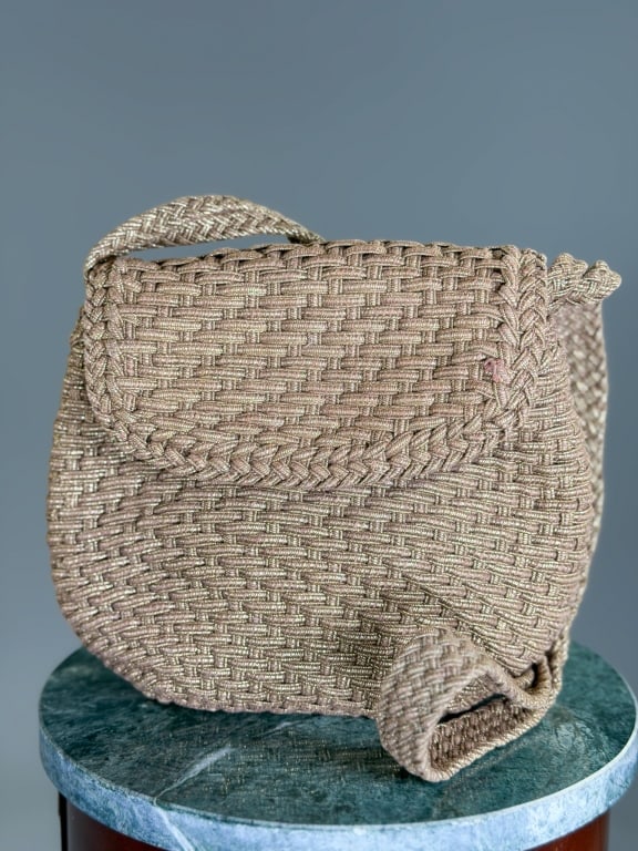 Vintage 1990s De Vecchi Woven Fabric Bag: Vintage 1990s De Vecchi Woven Fabric Bag having magnetic snap closure and crossbody strap. Measuring approximately 8 inches high by 10 inches wide by 2.5 inches deep. From the lifetime collection, fas