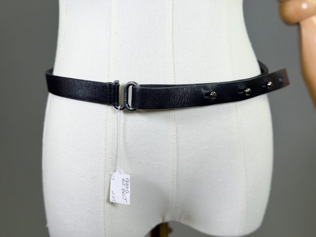 Vintage 1990s Prada Black Leather Waist Belt: Vintage 1990s Prada Black Leather Waist Belt having adjustable closure. Measuring approximately 39.5 inch total length. From the lifetime collection, fashion archive and business inventory of collecto