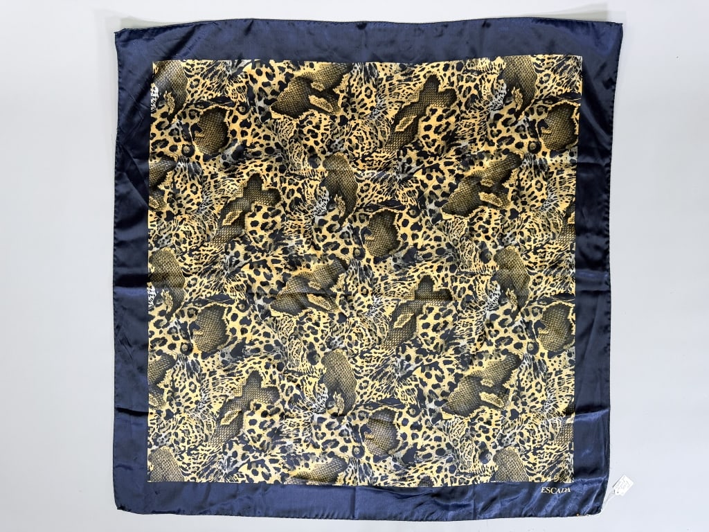 Vintage 1990s Escada Silk Animal Print Neck Scarf: Vintage 1990s Escada Silk Animal Print Neck Scarf having animal print throughout with hand rolled edges. Measuring approximately 33 inches by 33 inches. From the lifetime collection, fashion archive a