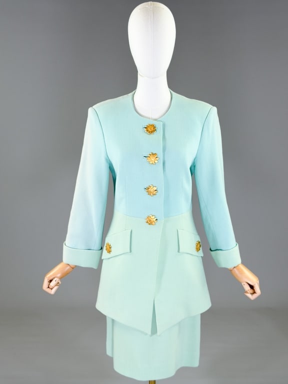 Vintage 1990s Nina Ricci Colorblock Skirt Suit Set: Vintage 1990s Nina Ricci Colorblock Skirt Suit Set having button front. Marked size 40. Jacket measuring 38 inch bust, 32 inch waist, 32 inches long, 21 inch sleeve length. Skirt with back zip closure
