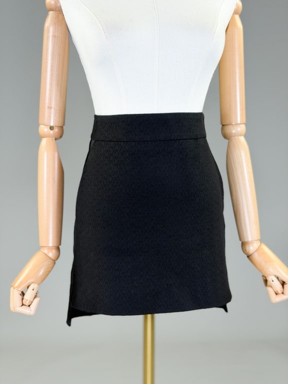 Vintage Dries Van Noten Wool Mini Skirt: Vintage Dries Van Noten Wool Mini Skirt having back zip closure and two front pockets. Marked size 38. Measuring 32 inch waist, 17 inches long. From the lifetime collection, fashion archive and busine