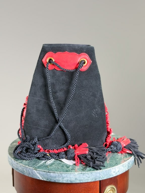 Vintage Renaud Pellegrino Suede Fringe Bucket Bag: Vintage Renaud Pellegrino Suede Fringe Bucket Bag having tie closure at top with fringe details around edges. Measuring approximately 9 inches high by 9 inches wide by 5 inches deep. From the lifetime