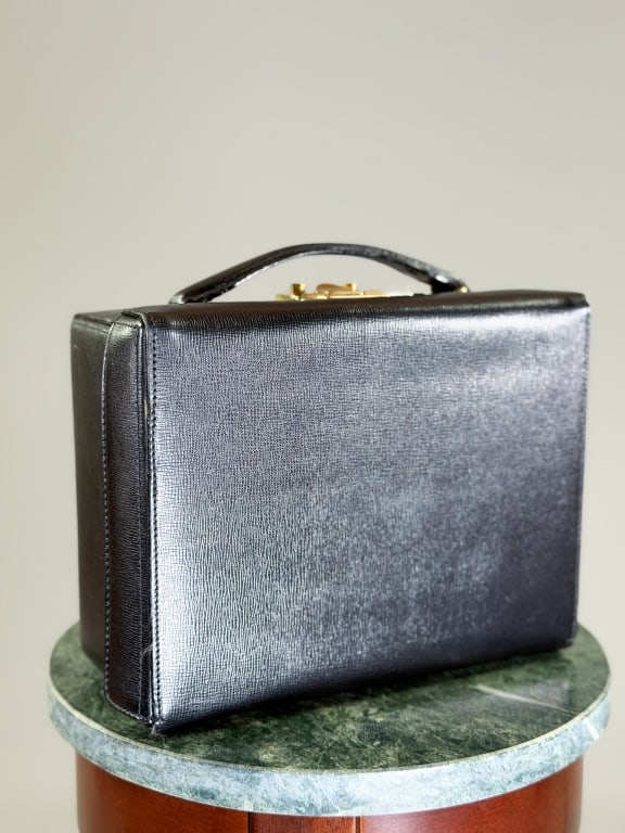 Vintage Mark Cross Leather Box Bag: Vintage Mark Cross Leather Box Bag having lock closure at top with removable cross body strap. Measuring approximately 7 inches high by 9 inches wide by 4 inches deep. Dustbag included. From the lifet