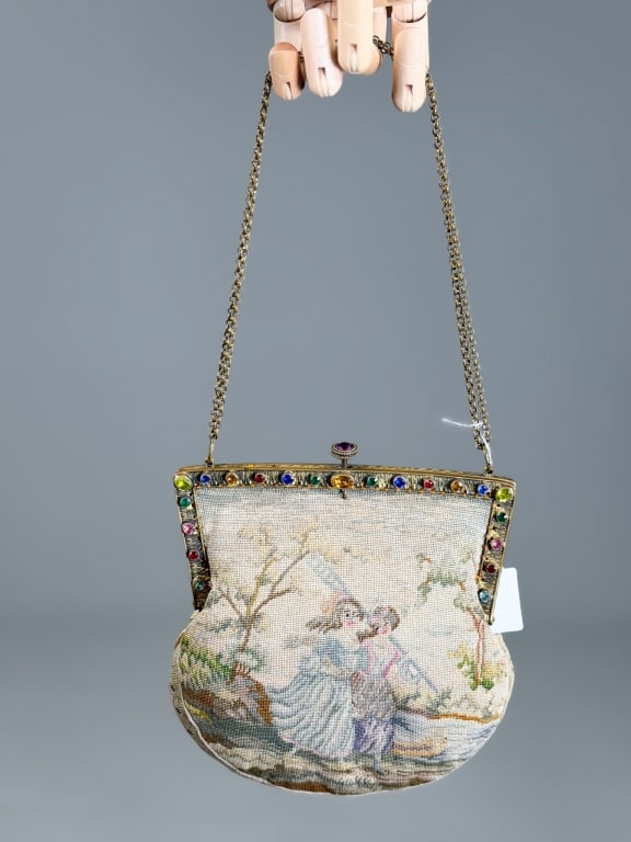 Antique Figural Needlepoint Rhinestone Evening Bag: Antique Figural Needlepoint Rhinestone Evening Bag having rhinestone set metal frame lock closure and chain strap. Measuring approximately 6.5 inches high by 7 inches wide by 1 inch deep. General wear