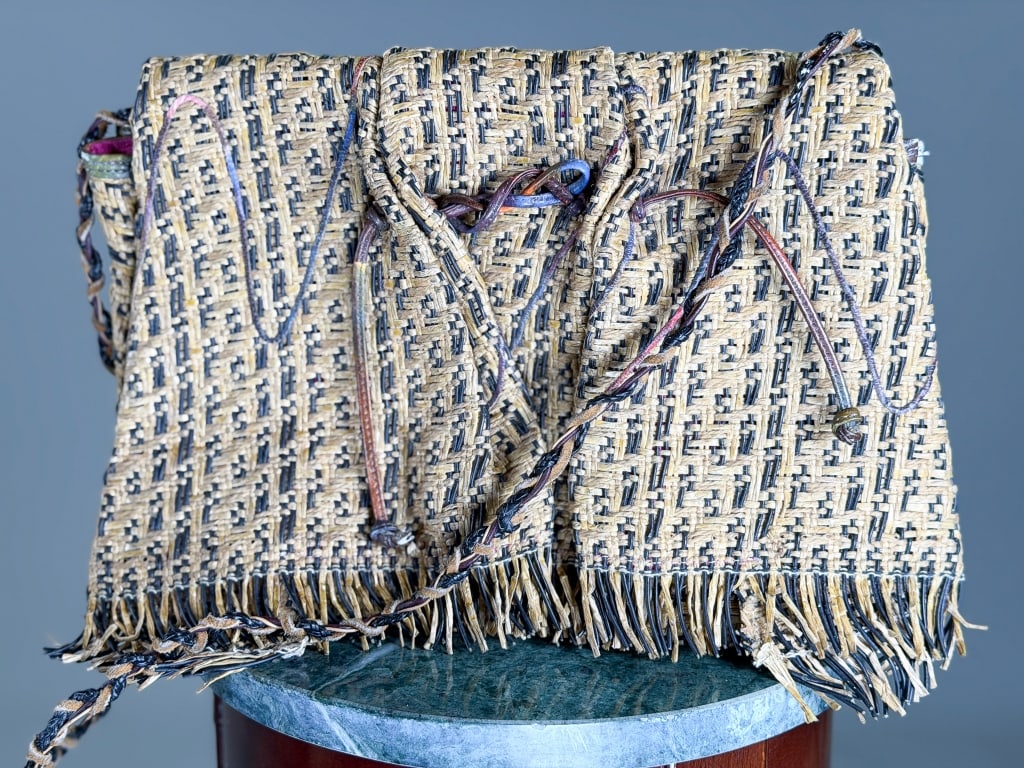 Vintage Carlos Falchi Woven Crossbody Bag: Vintage Carlos Falchi Woven Crossbody Bag having magnetic snap closure with fringe detail. Measuring approximately 9 inches hy by 13 inches wide. From the lifetime collection, fashion archive and busi