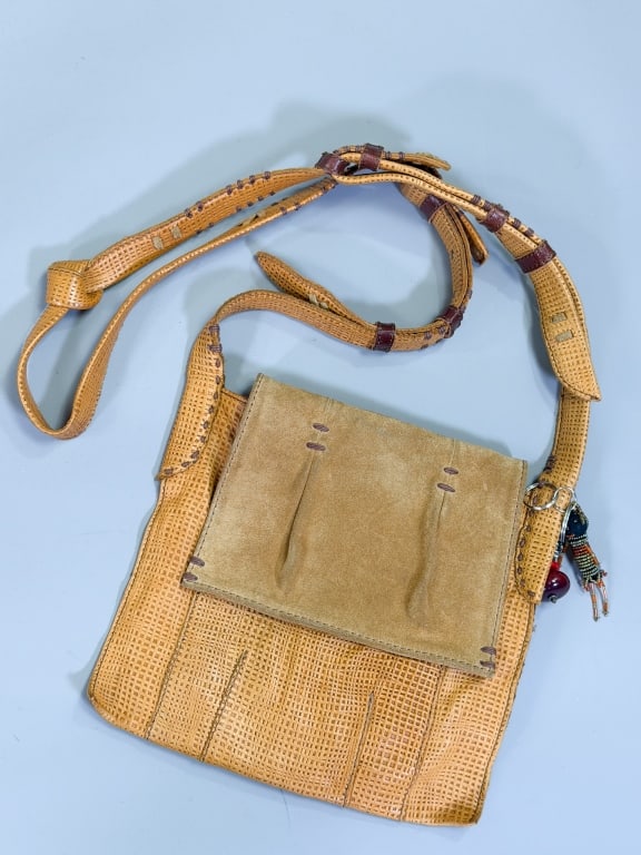 Vintage Woven Leather Suede Cross Body Bag: Vintage Woven Leather Suede Cross Body Bag having flap closure with interior pocket. Measuring approximately 10 inches high by 10 inches wide. From the lifetime collection, fashion archive and busines