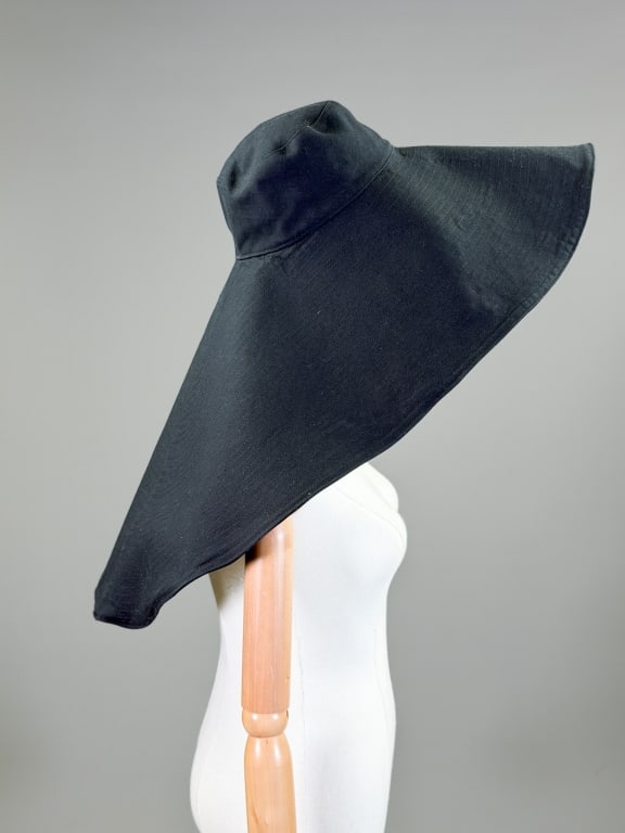 Vintage Cotton Oversized Sun Hat: Vintage Cotton Oversized Sun Hat having stitching throughout with oversized brim. Interior circumference measuring approximately 22 inches. Hat measuring approximately 32 inches total length. From the