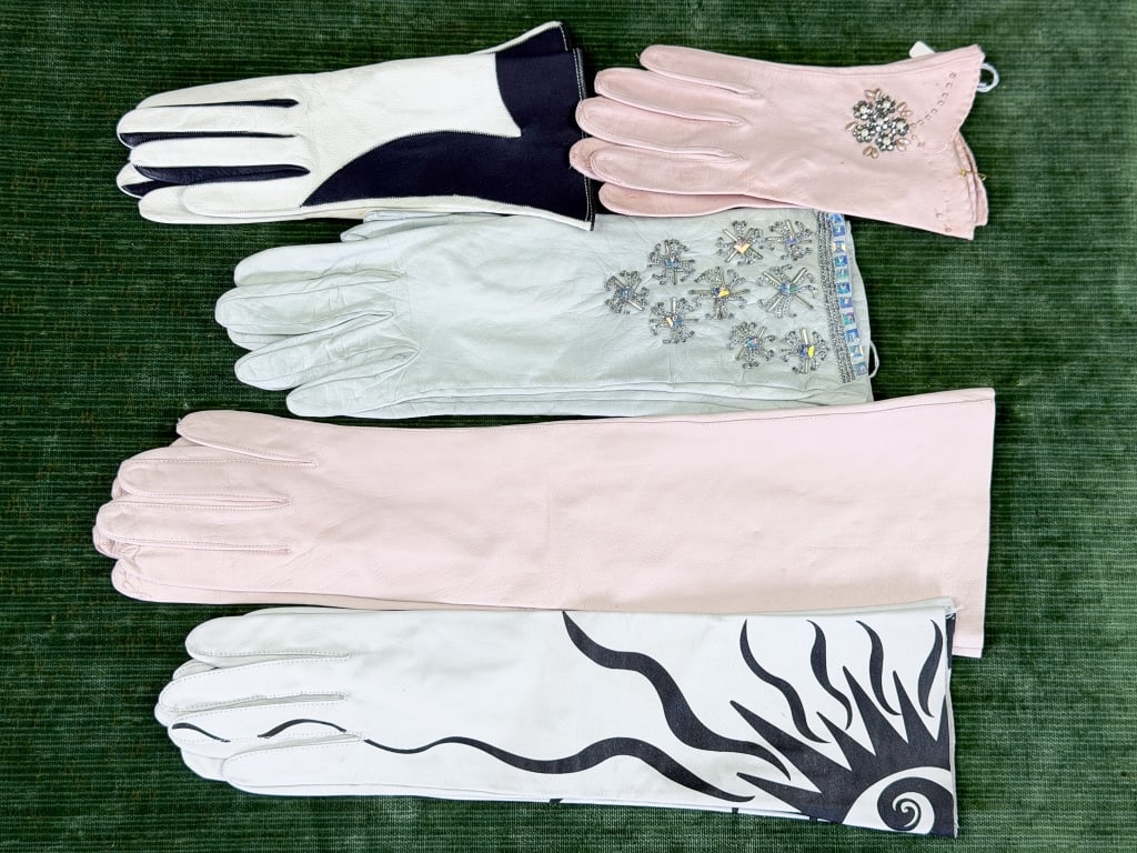 Collection of Leather Embellished Printed Gloves: Collection of Leather Embellished Printed Gloves including five total pairs in various sizes. Longest pair measuring approximately 17 inches long. From the lifetime collection, fashion archive and bus