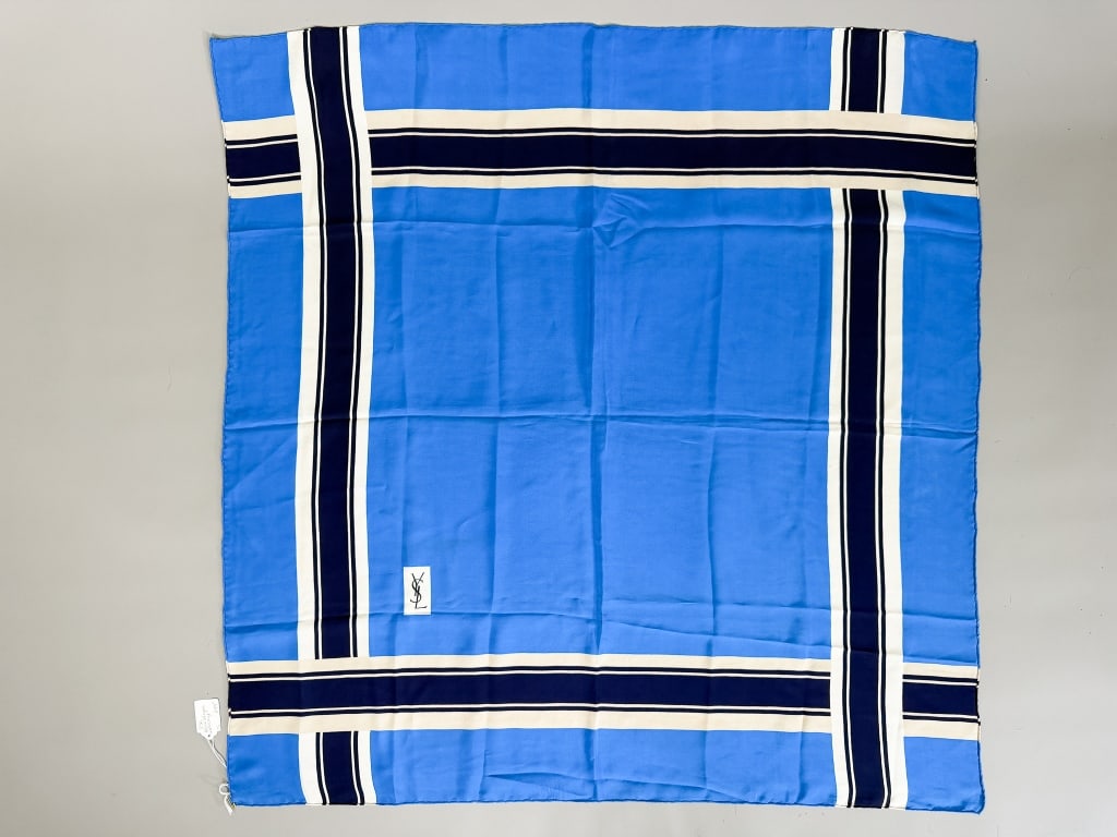 Vintage Yves Saint Laurent Silk Printed Scarf: Vintage Yves Saint Laurent Silk Printed Scarf having print throughout with logo at corner. Measuring approximately 33 inches by 33 inches. From the lifetime collection, fashion archive and business in