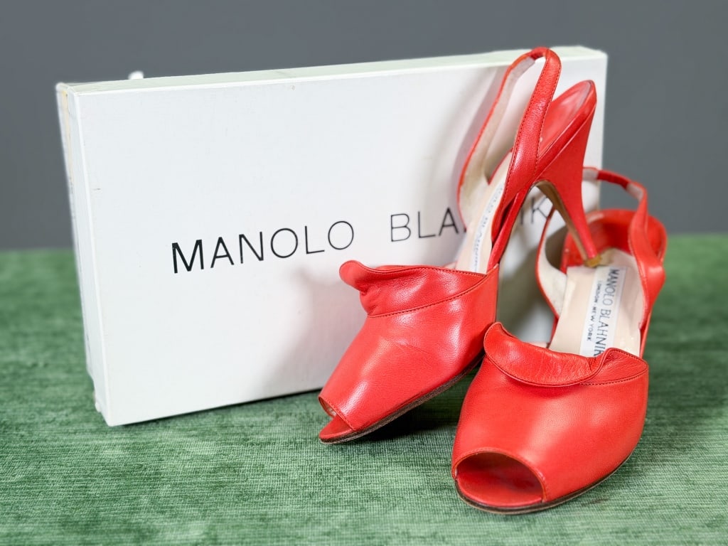Vintage Manolo Blahnik Leather Heels Pumps: Vintage Manolo Blahnik Leather Heels Pumps having peep-toe and elastic ankle strap. Marked size 37. Measuring approximately 9.5 inches heel to toe. Original box included. General wear as shown through