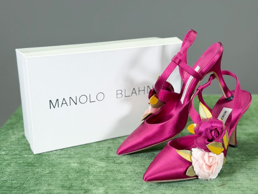 Vintage Manolo Blahnik Satin Floral Heels Pumps: Vintage Manolo Blahnik Satin Floral Heels Pumps having floral detail at side with elastic ankle strap. Marked size 37. Measuring approximately 9.5 inches heel to toe. Original box included. General we