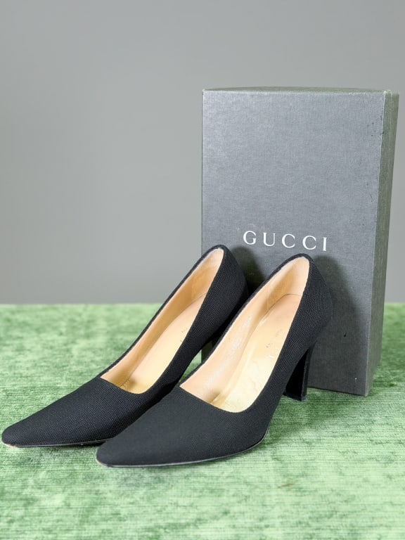 Vintage Gucci Fabric Heels Pumps: Vintage Gucci Fabric Heels Pumps having pointed toe and stacked wooden heel. Marked size 7B. Measuring approximately 10 inches heel to toe. Original box included. General wear as shown throughout. Fro