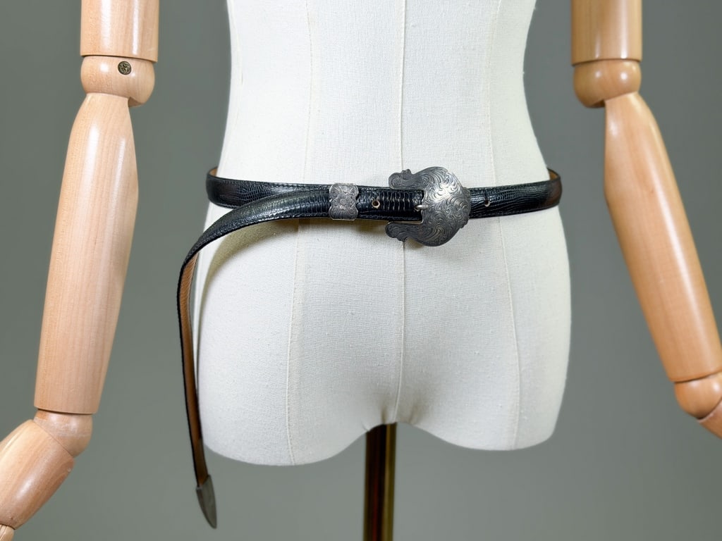 Vintage Leather Sterling Overlay Western Belt: Vintage Leather Sterling Overlay Western Belt having sterling silver overlay buckle and details. Labeled Al Beres U.S.A. Genuine Leather. Marked size M. Measuring approximately 28-32 inch waist, 47 in