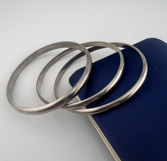 Three Vintage Sterling Bracelets Weighing 68 Grams: Three Vintage Sterling Bracelets Weighing 68 Grams. Three bangle bracelets, hallmarks, weighing approximately 68.4 grams total weight. Each measures approximately 2.5 inches across the interior openin