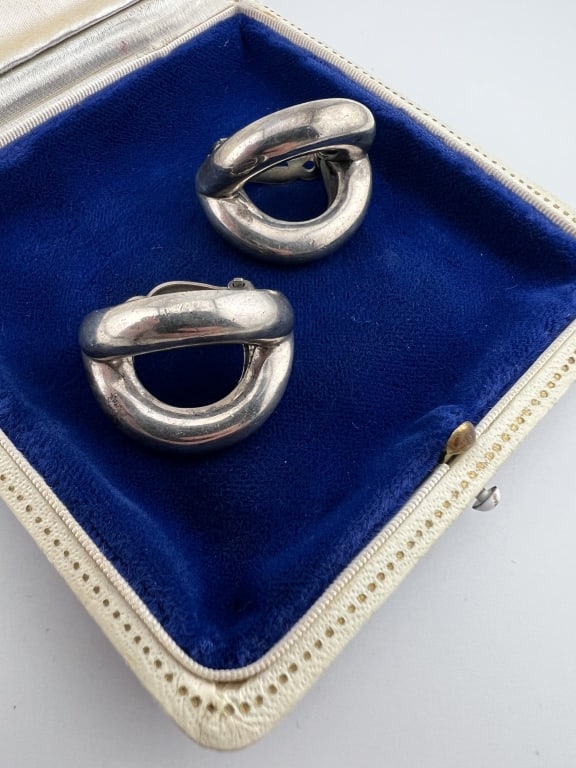 Pair Modernist Design Sterling Silver Earrings: Pair Modernist Design Sterling Silver Earrings. Hallmarked. Clip backs. Each measures 1.25 inches in length. Total weight approximately 22.6 grams, From the lifetime collection, fashion archive and bu