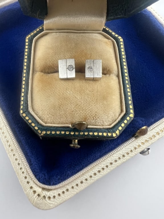 Pair of Sterling Silver & Diamond Stud Earrings: Pair of Sterling Silver & Diamond Stud Earrings. Hallmarked. Stones test as diamond on the Presidium. Each measures .25 of an inch in length. From the lifetime collection, fashion archive and business