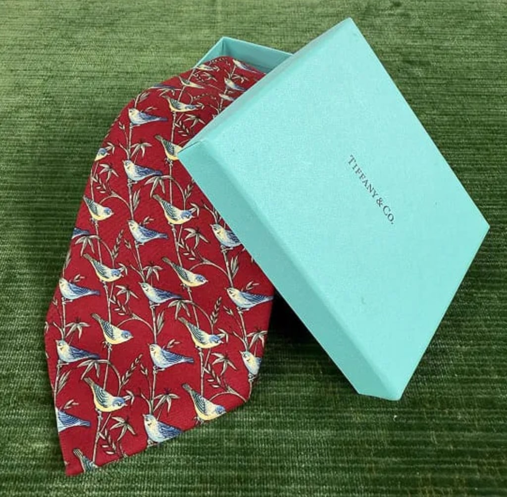 Vintage Tiffany & Co Silk Men's Neck Tie w Box: Vintage Tiffany & Co Silk Men's Neck Tie w Box. Silk fabric with bird print pattern. Comes with original box, tagged TIFFANY & CO. Marked 100% silk and MADE IN ITALY. Measures 58 inches in length.