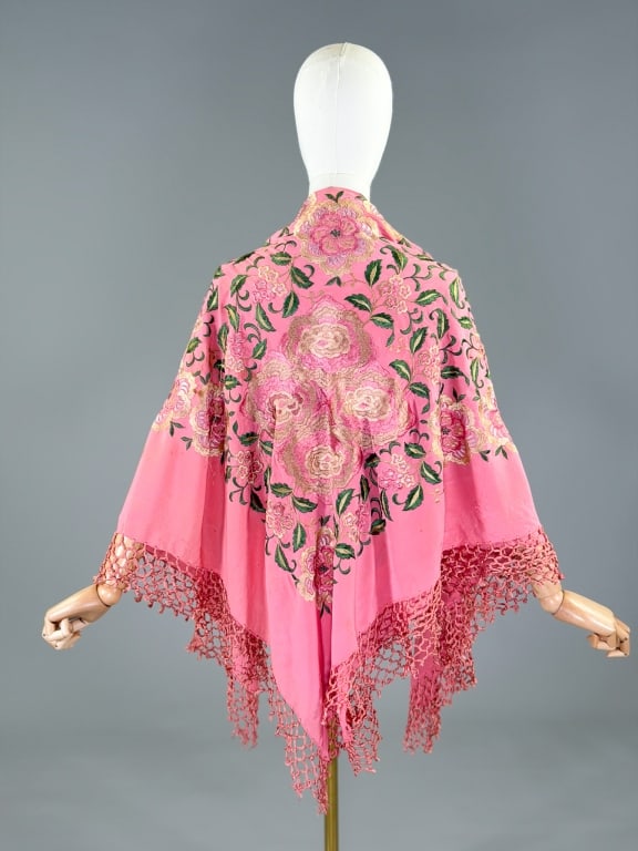 Antique Chinese Silk Embroidered Pink Piano Shawl: Antique Chinese Silk Embroidered Pink Piano Shawl. Having a knotted fringe border. Measures approximately 45 x 49 inches, not including the silk tassel fringe border. Scene of embroidered silk thread 