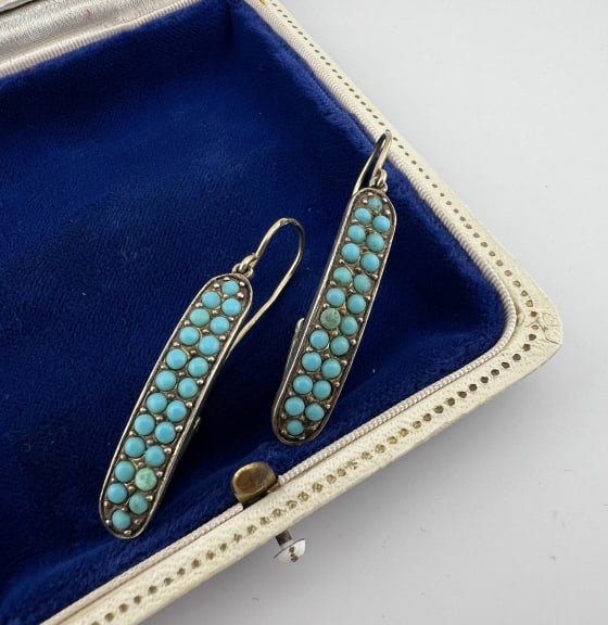 Estate 14kt Gold Sterling & Turquoise Earrings: Estate 14kt Gold Sterling & Turquoise Earrings. Pair of earrings with 14kt yellow gold ear wires, sterling silver pendants, turquoise colored round cabochons. Hallmarked 14k and 925. Measures 1.75 inc