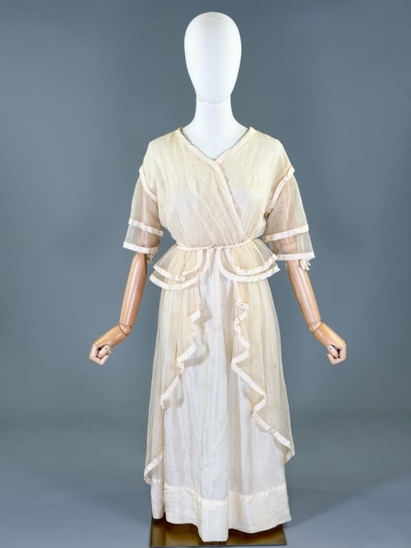 Antique Edwardian 1900s Silk Net Lawn Tea Dress: Antique Edwardian 1900s Silk Net Lawn Tea Dress having snap closure at back with peplum at waist. Measuring 38 inch bust, 26 inch waist, 46 inches long, 12 inch sleeve length. General wear as shown th