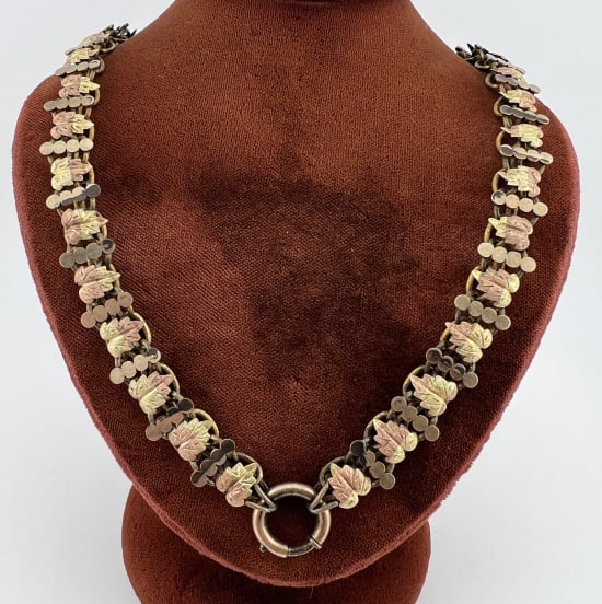 Antique 19th C Gold Filled Book Chain Necklace: Antique 19th C Victorian Era Gold Filled Book Chain Necklace. Articulated leave motif two tone gold filled necklace chain with large spring ring. Measures just over 19 inches in length.