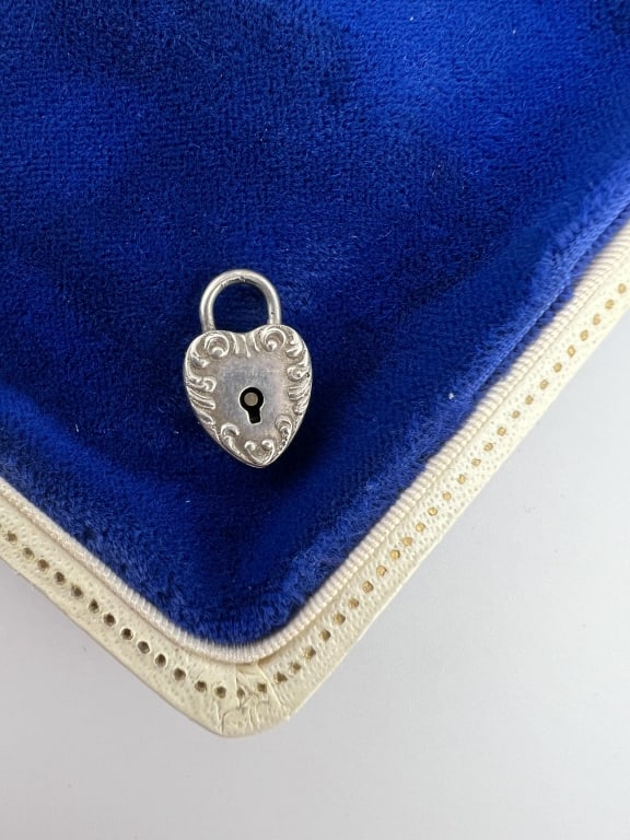 Antique Sterling Silver Heart Padlock Pendant: Antique Sterling Silver Heart Padlock Pendant. Stamped STERLING on the back. Measures .75 of an inch in length.