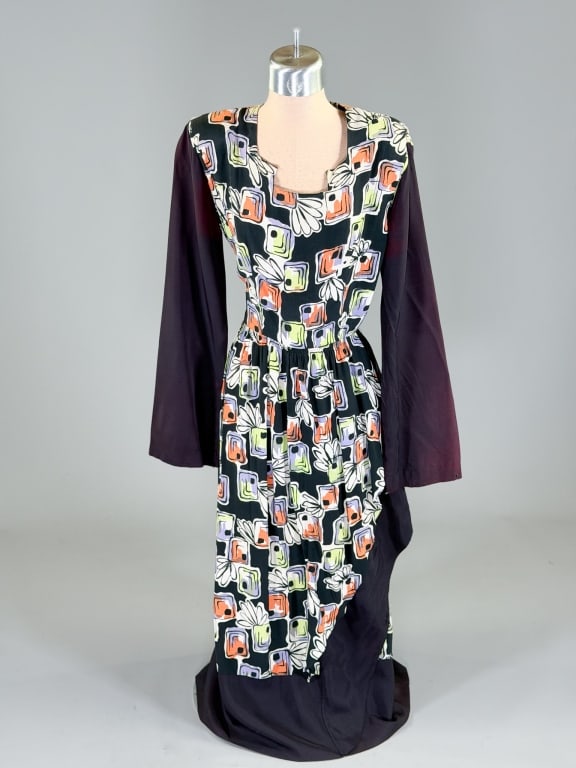 Vintage 1940s Printed Rayon Draped Dress: Vintage 1940s Printed Rayon Draped Dress having side zip closure with drape details throughout. Measuring 36 inch bust. 26 inch waist, 37 inches long, 24 inch sleeve length. General wear as shown thro