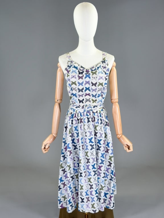 Vintage 1950s Cotton Butterfly Print Day Dress: Vintage 1950s Cotton Butterfly Print Day Dress having back zip closure with belt at waist. Measuring 34 inch bust, 26 inch waist, 45 inches long. General wear as shown throughout.