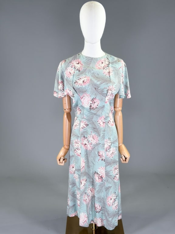 Vintage 1940s Floral Feather Print Day Dress: Vintage 1940s Floral Feather Print Day Dress having back, neck and side zip closures. Measuring 36 inch bust, 28 inch waist, 44 inches long, 9 inch sleeve length. General wear as shown throughout.