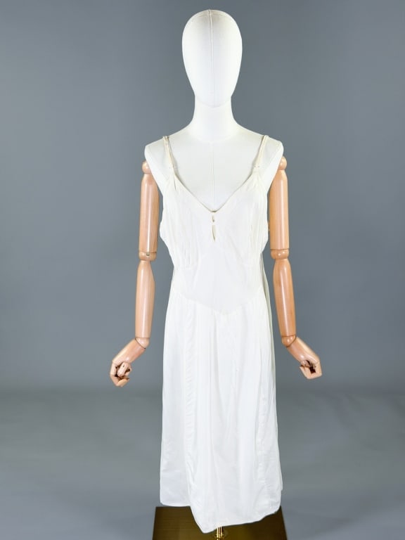 Vintage 1940s Rayon Slip Dress Night Gown: Vintage 1940s Rayon Slip Dress Night Gown having scalloped stitched details at bust, bias cut with stretch throughout. Measuring 36-44 inch bust, 28-38 inch waist, 43 inches long. General wear as show