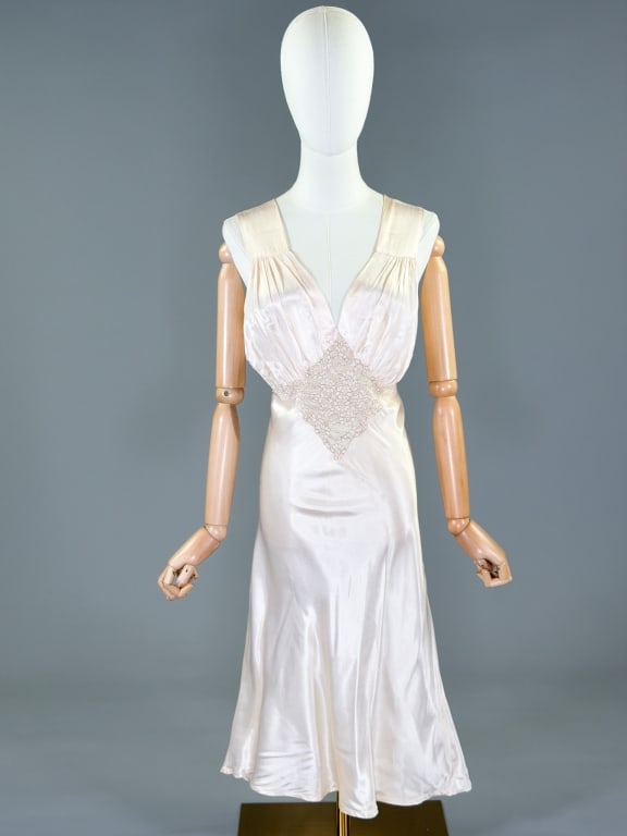 Vintage 1940s Rayon Satin Slip Dress Night Gown: Vintage 1940s Rayon Satin Slip Dress Night Gown having lace detail at bust, bias cut with stretch throughout. Measuring 32-40 inch bust, 24-32 inch waist, 44 inches long. General wear as shown through