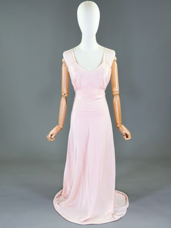 Vintage 1940s Rayon Slip Dress Night Gown: Vintage 1940s Rayon Slip Dress Night Gown having floral embroidery at bust with stretch throughout and tie at waist. Marked size 36. Measuring 32-38 inch bust, 24-32 inch waist, 52 inches long. Genera