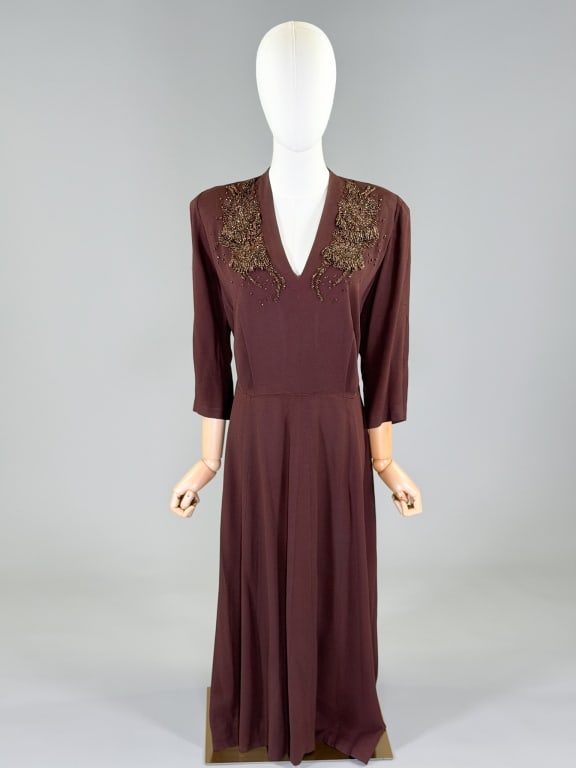 Vintage 1940s Rayon Crepe Beaded Evening Dress: Vintage 1940s Rayon Crepe Beaded Evening Dress having side zip closure and beading at neckline. Measuring 42 inch bust, 36 inch waist, 50 inches long, 19 inch sleeve length. General wear as shown thro