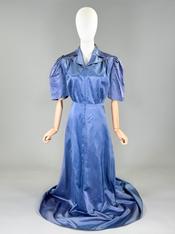 Vintage 1940s Rayon Satin Zip Front Hostess Gown: Vintage 1940s Rayon Satin Zip Front Hostess Gown having zip front closure with ruched details at front measuring 34-40 inch bust, 30 inch waist, 60 inch front length, 63 inch back length, 14 inch slee